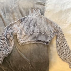 This light purple cropped turtleneck sweater